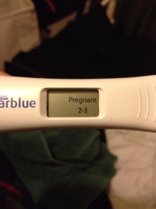 A close up picture of a positive pregnancy test.